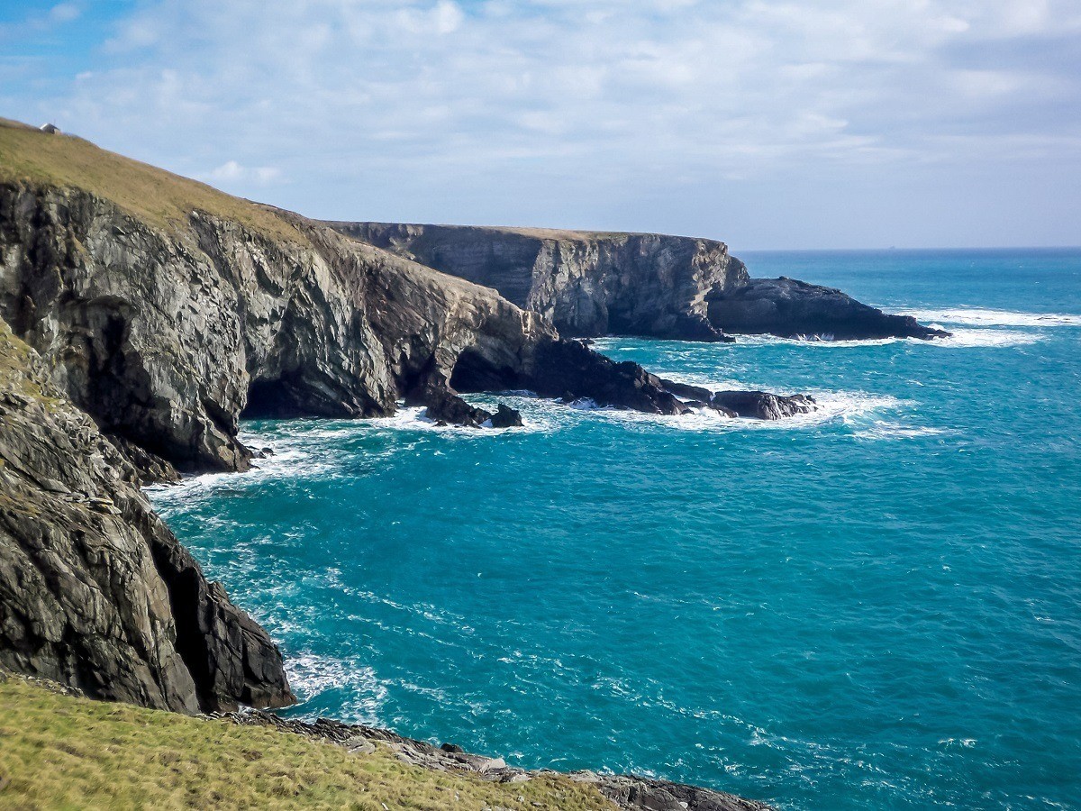 Cliffs meeting the blue water of the Atlantic Ocean at Mizen Head
