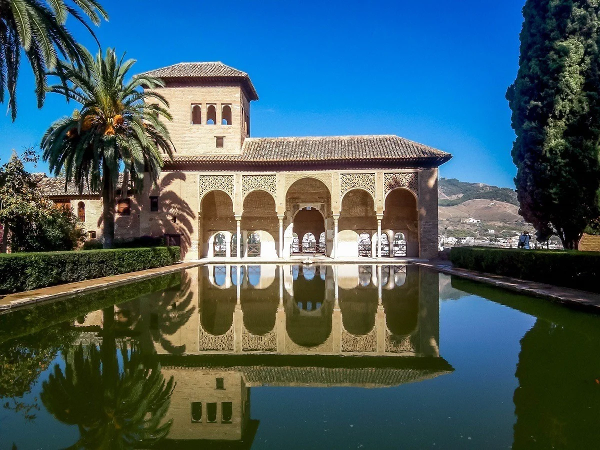 Pool and palm trees at the Alhambra in Granada, Spain