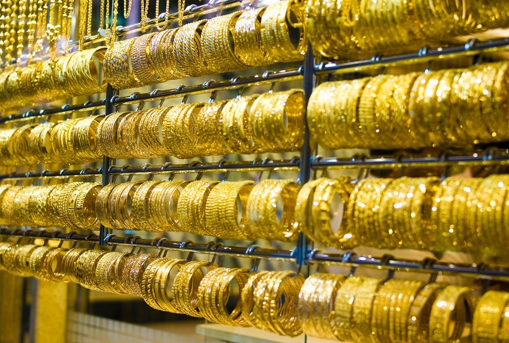 Rows of gold bracelets in jewelry store