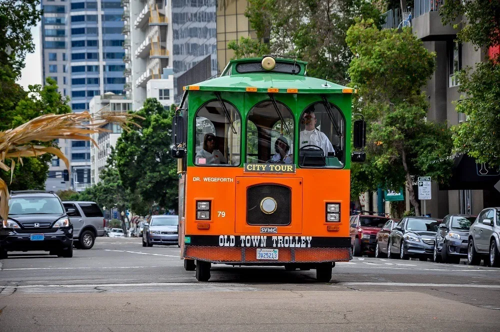 The green and orange Old Town Trolley