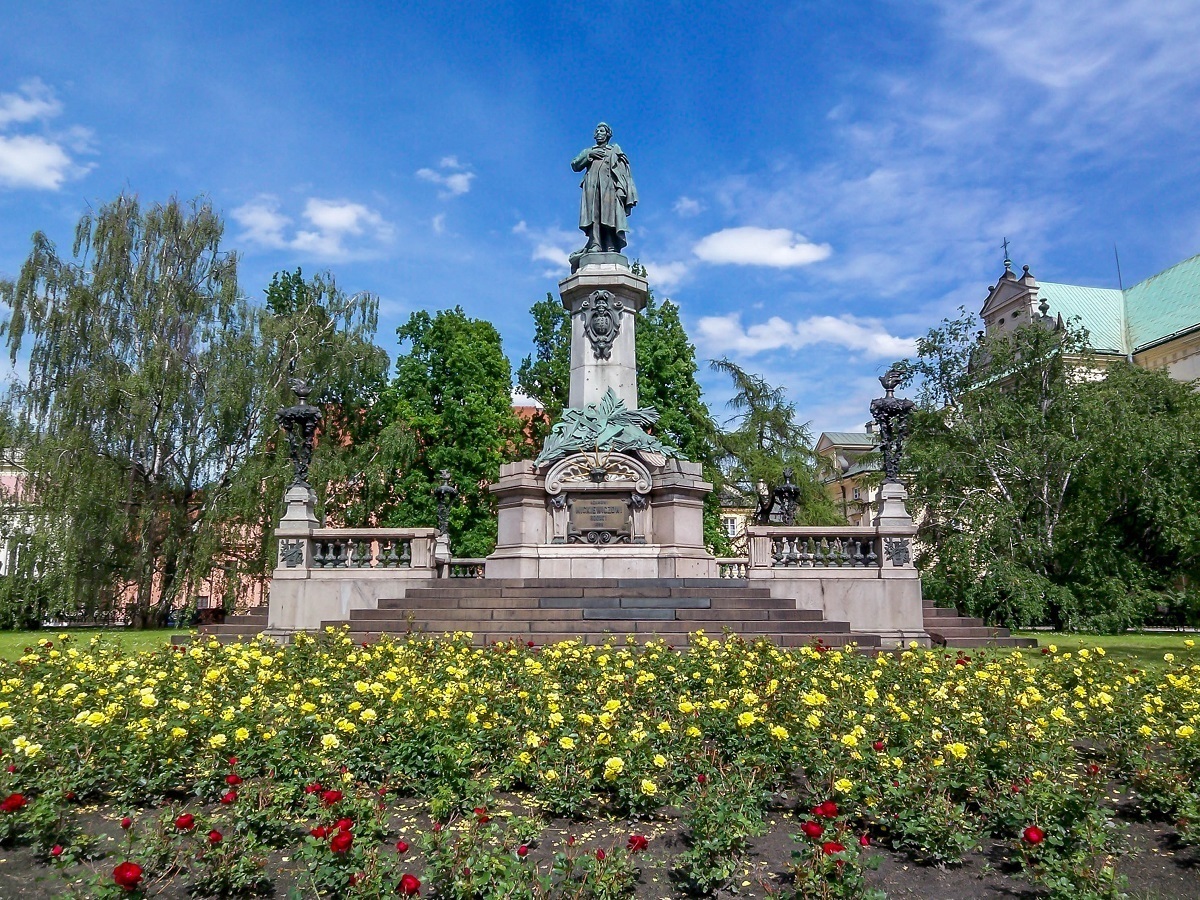 The Adam Mickiewicz statue with flowers