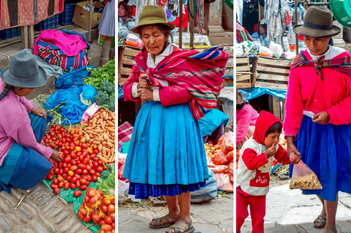 Women in traditional garb buying and selling at the Pisac market
