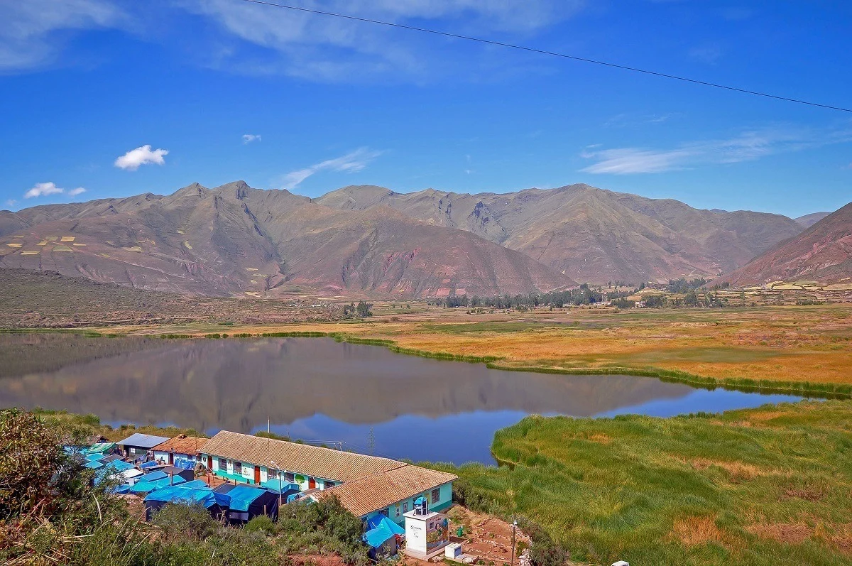Tent camp on the edge of mountain lake outside Cusco
