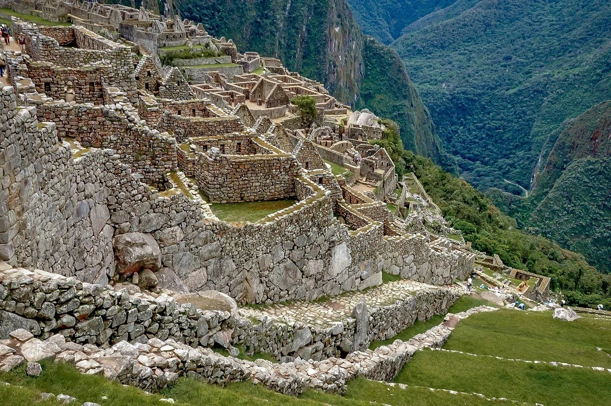 Steep staircase leading down to the ruins of houses at Machu Picchu