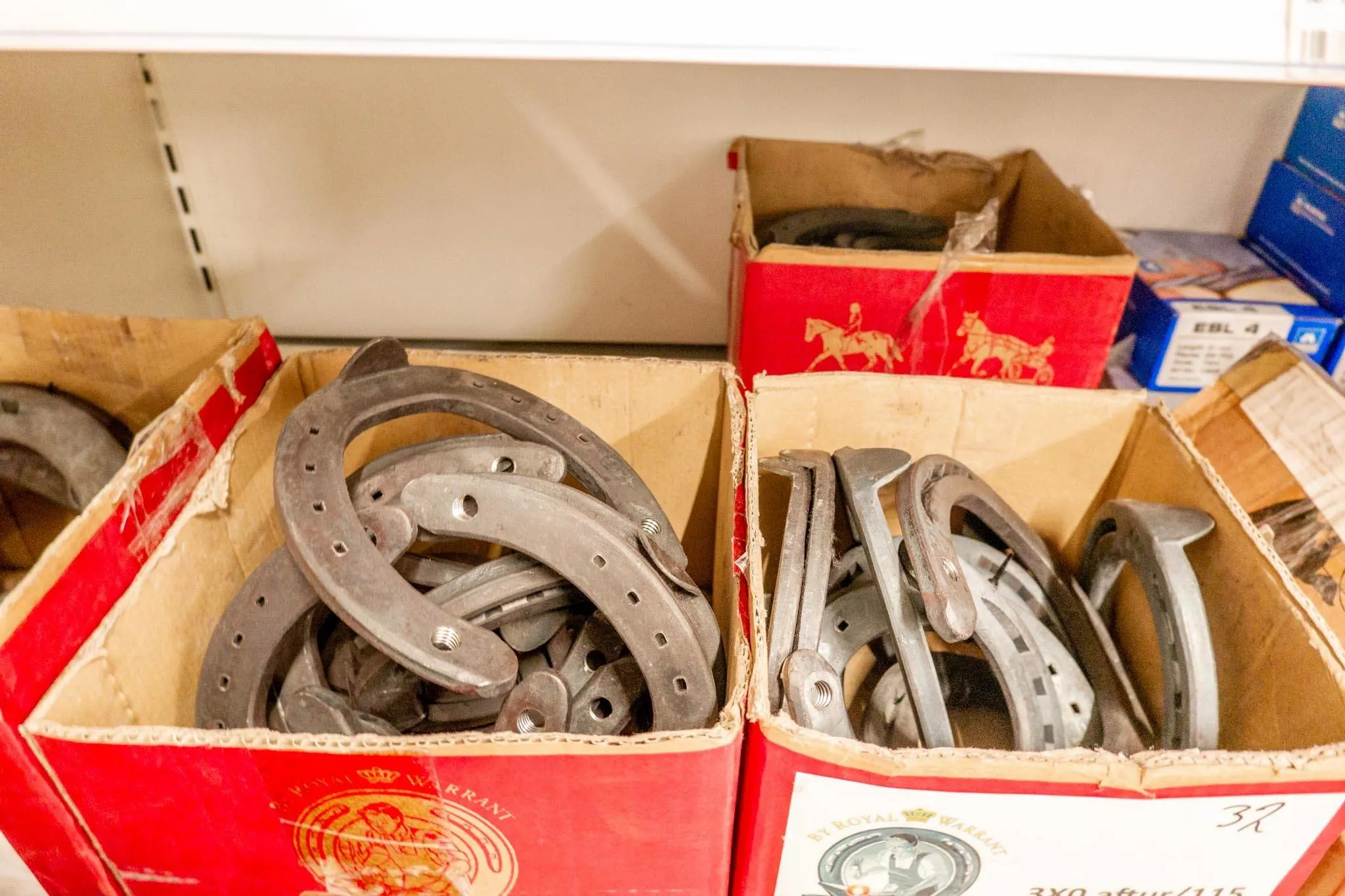 Boxes of horseshoes and farm supplies