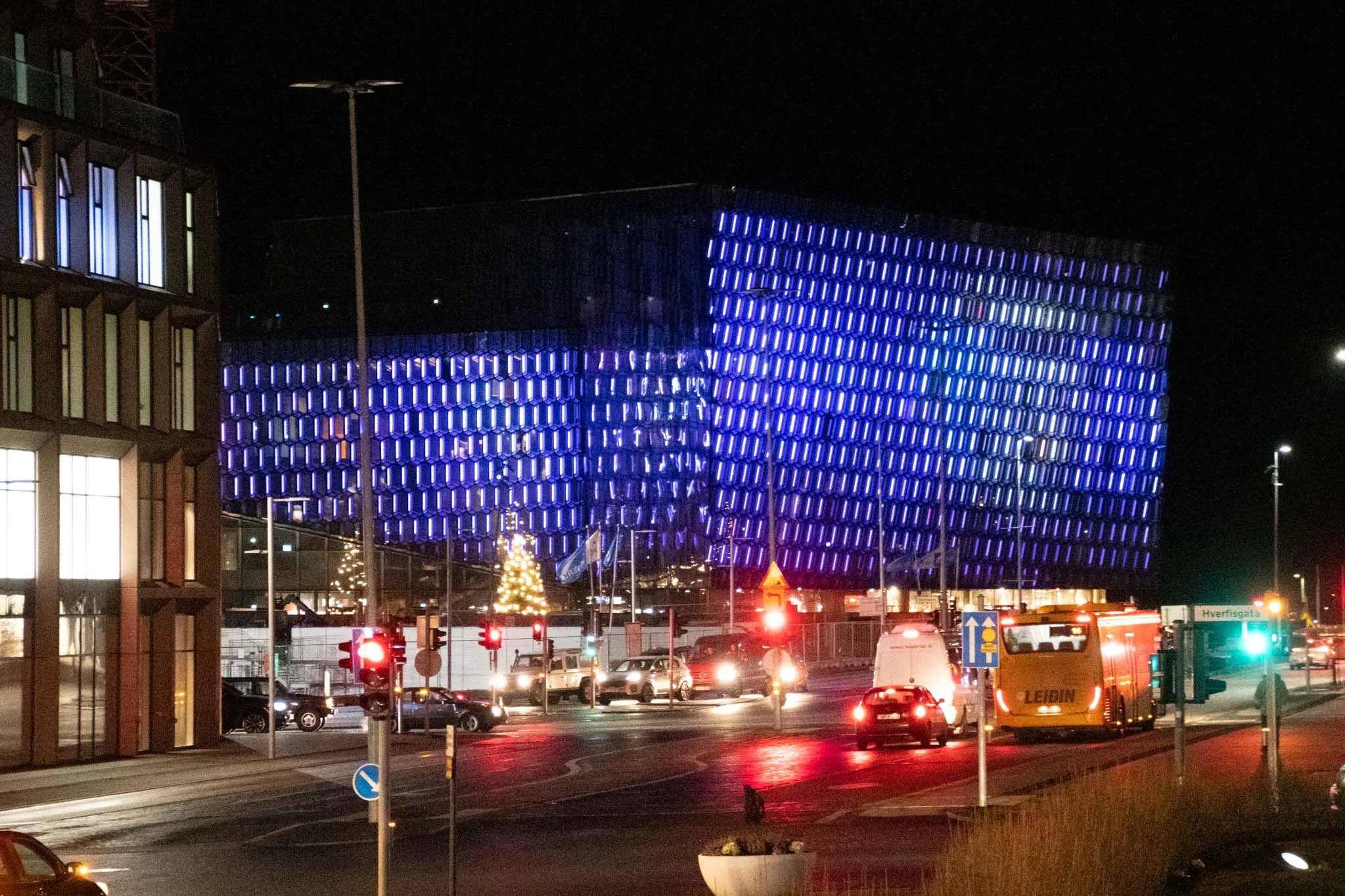 Geometric illuminated building at night.