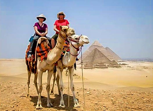 Riding camels in Egypt