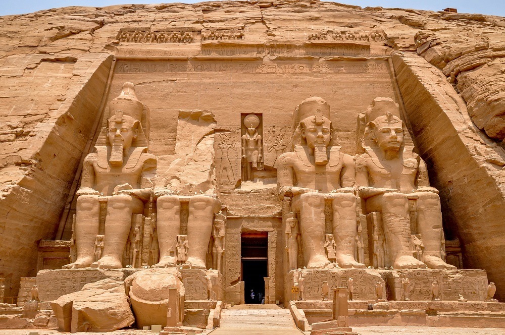 Four giant carvings of a pharaoh out of rock at Abu Simbel in Egypt 