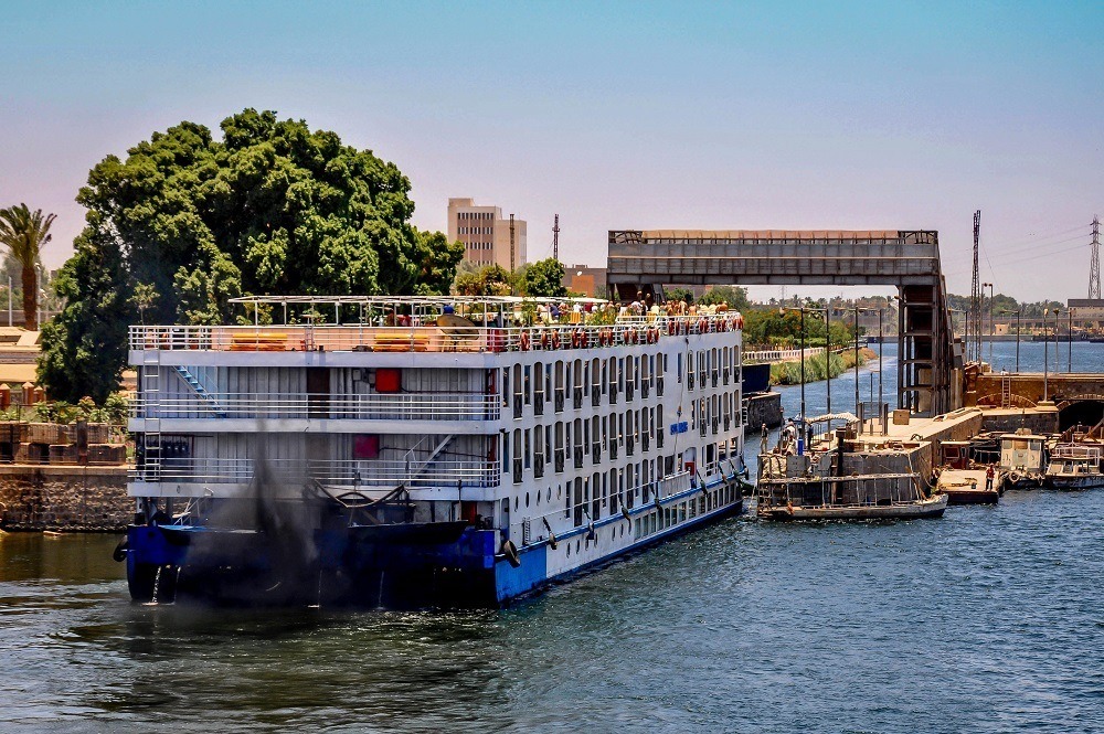 Cruise boat passing through locks on the Nile