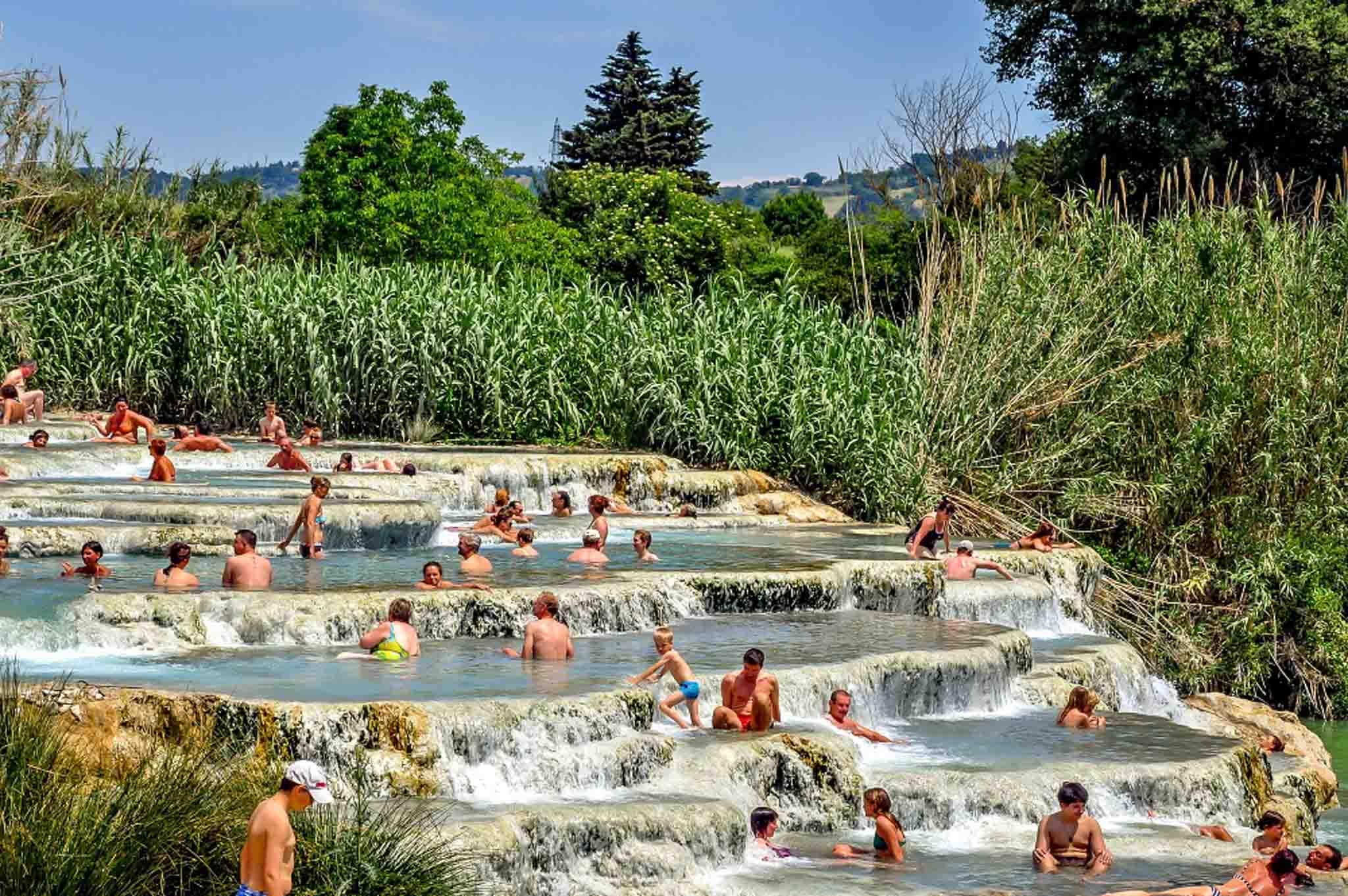 Swimmers in the beautiful Saturnia springs in Tuscany between Rome and Florence!