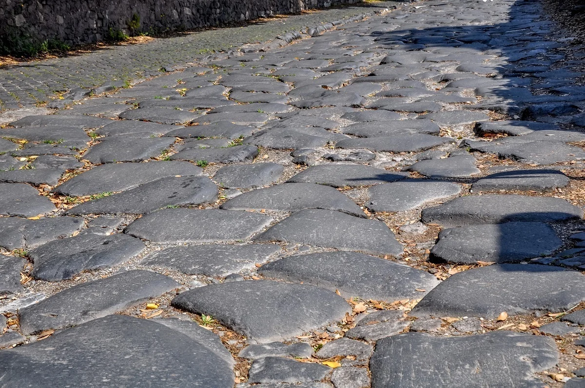 The rough cobblestones of the Appian Way Rome