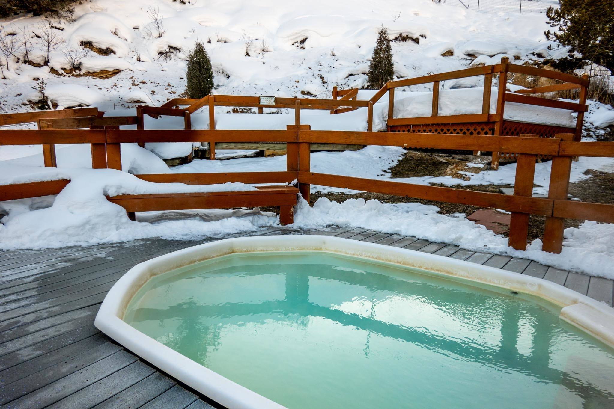 A pool at the Hot Sulphur Springs in winter with snow