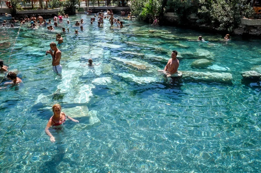 People in Cleopatra's pool (antique pool) at the Pamukkale hot springs