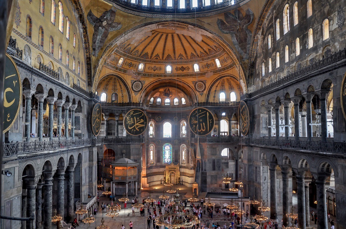 Inside the Hagia Sophia, a large domed room with tile work