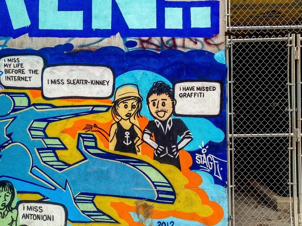 Hipster street art cartoon in the Toronto graffiti alley