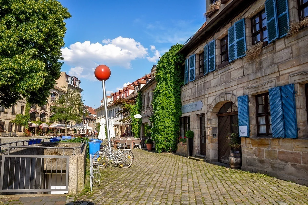 Life in Erlangen, Germany is characterized by sculptures and bike racks on a local street