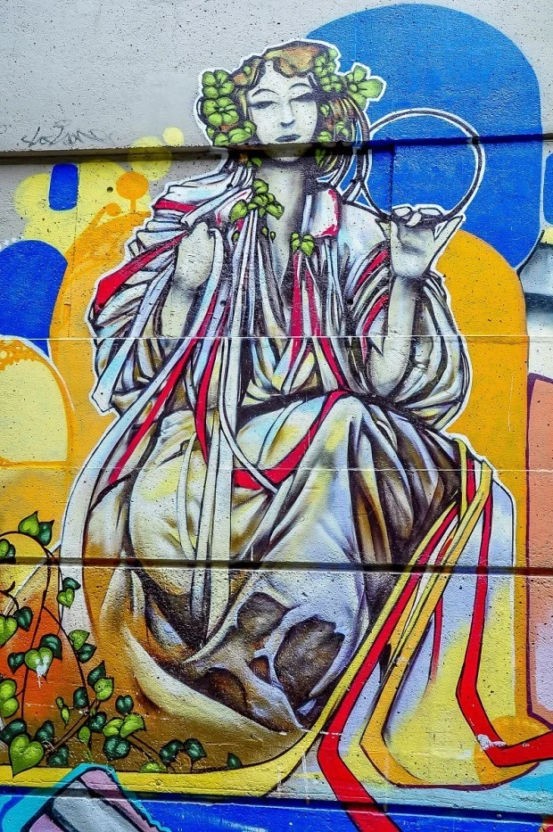 Street mural of woman in a toga