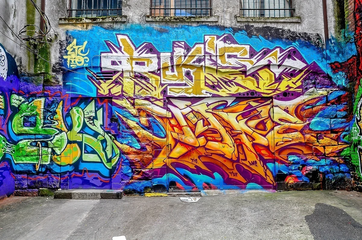 Multi-colored graffiti tag on concrete wall