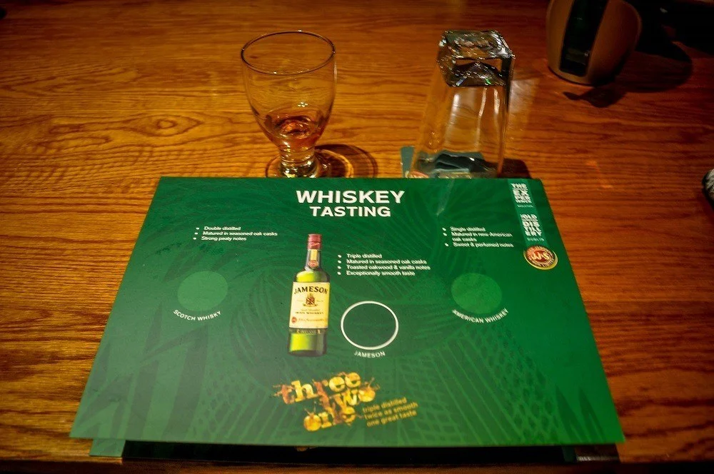 Glass and mat for whiskey tasting at Jameson Distillery