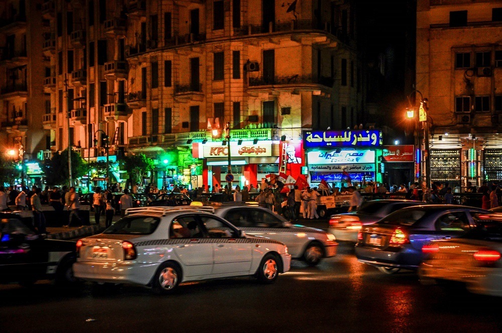 Cars and protesters in Tahrir Square in Cairo