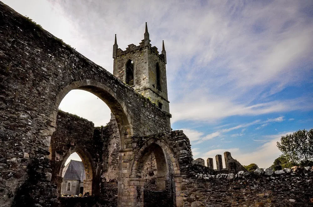 Ancient stone tower and wall with arches cut out