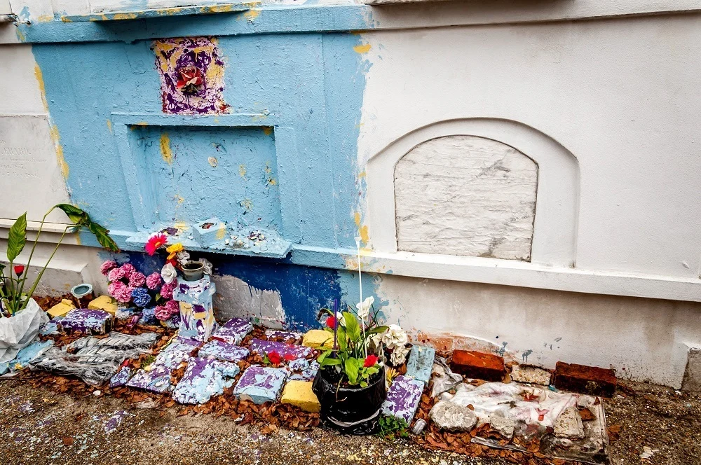 Above-ground tomb painted blue.