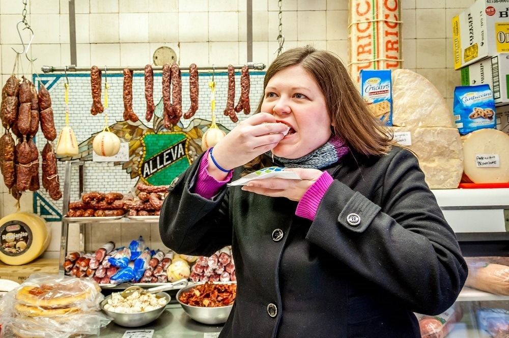 Laura enjoying tasty delights on a New York Food Tour