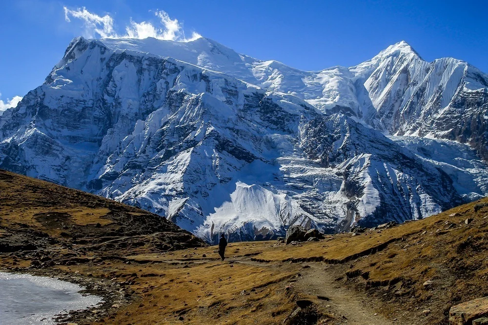 Man walking in the Himalayan Kingdom of Nepal near Braka