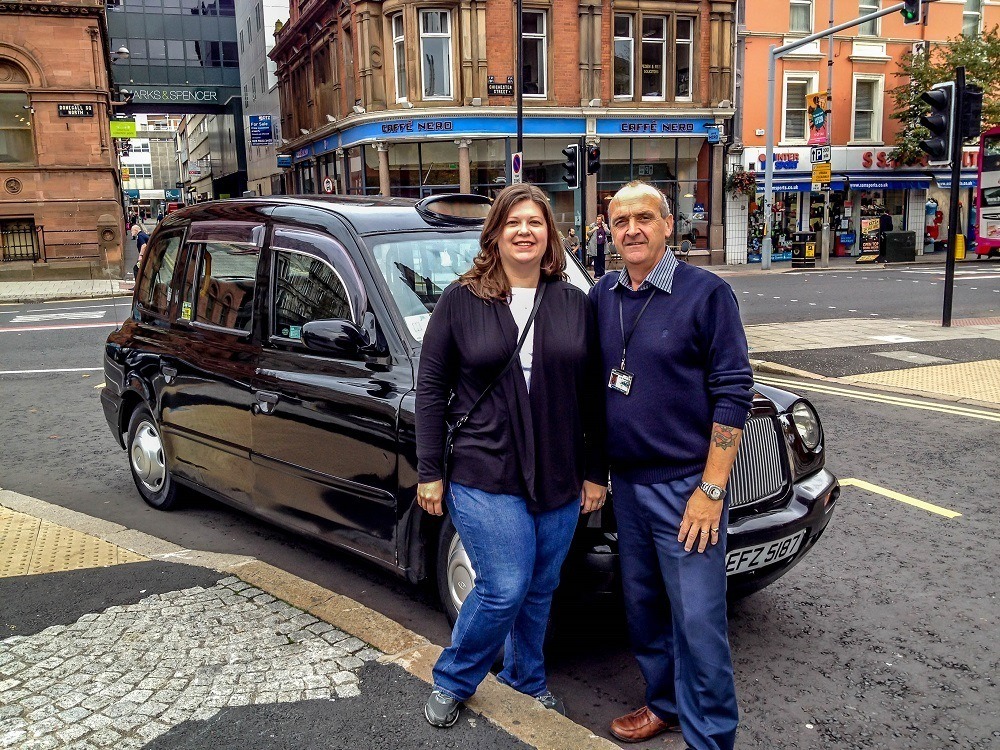 Laura and Paddy Campbell, in front of classic black cab