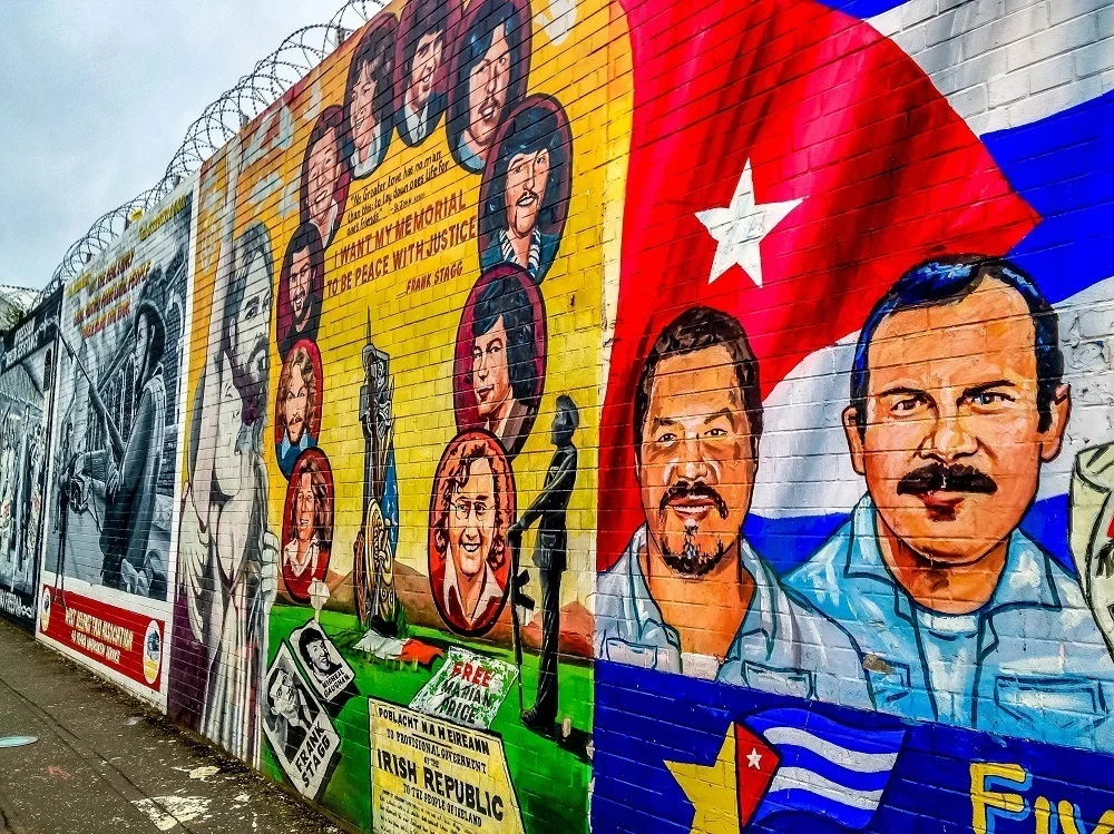 Street art mural showing Cubans and the Cuban flag