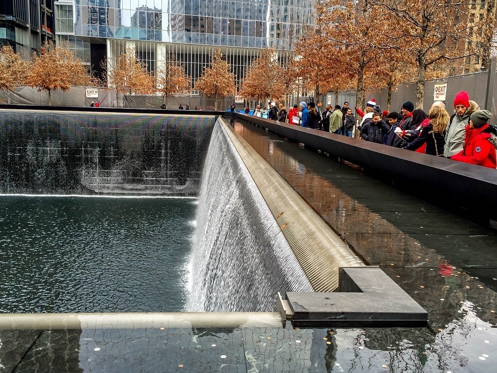 Visitors at one of the pools of the September 11 Memorial