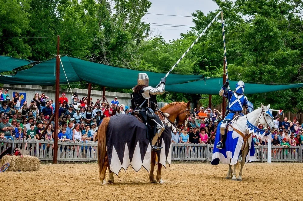 Two knights joust on horseback