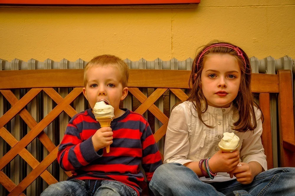 Two young Irish children enjoying their ice cream