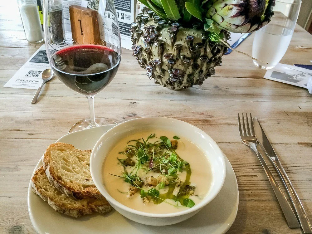 Bowl of cauliflower and gorgonzola soup with bread