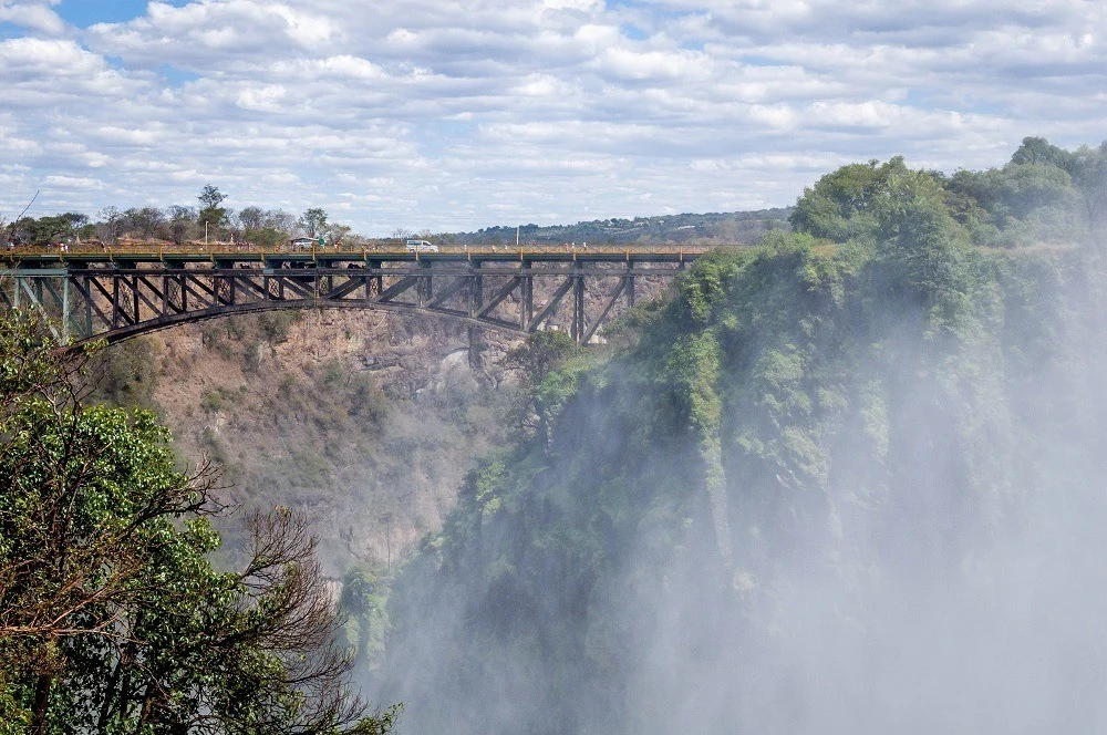The mist at Victoria Falls and the Victoria Falls Bridge