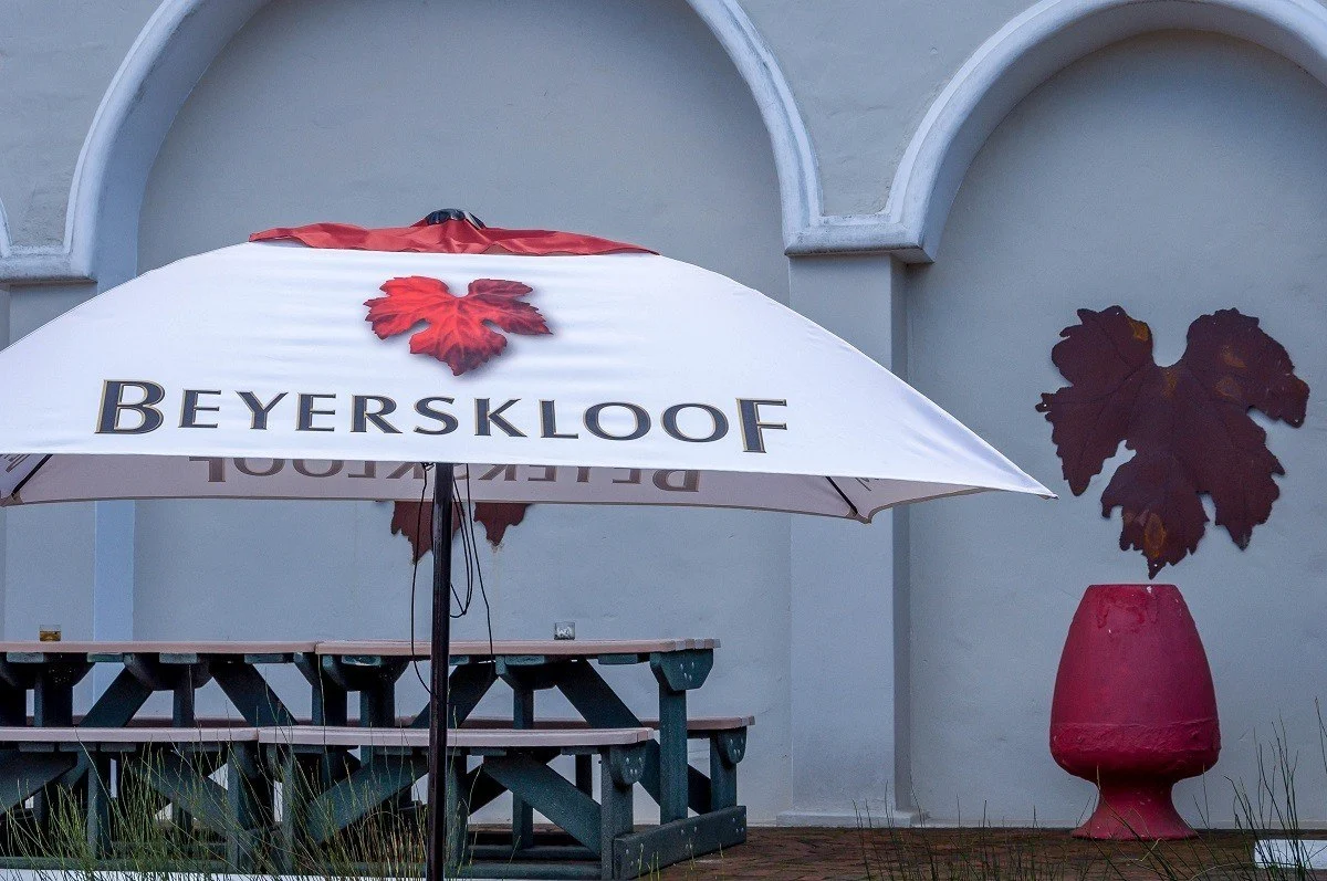 Picnic tables and umbrella at the Beyerskloof winery on the Stellenbosch Wine Route