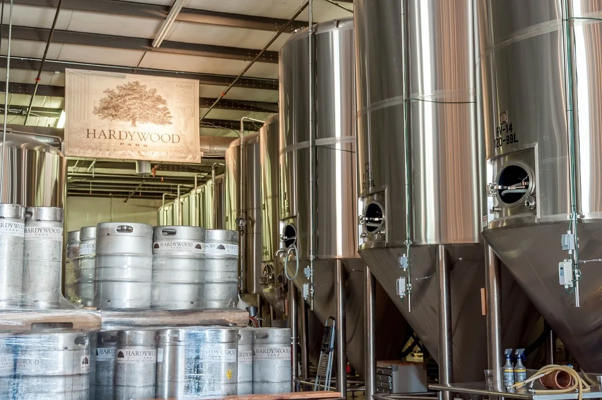 The stainless steel fermentation tanks and kegs at the Hardywood Park Craft Brewery