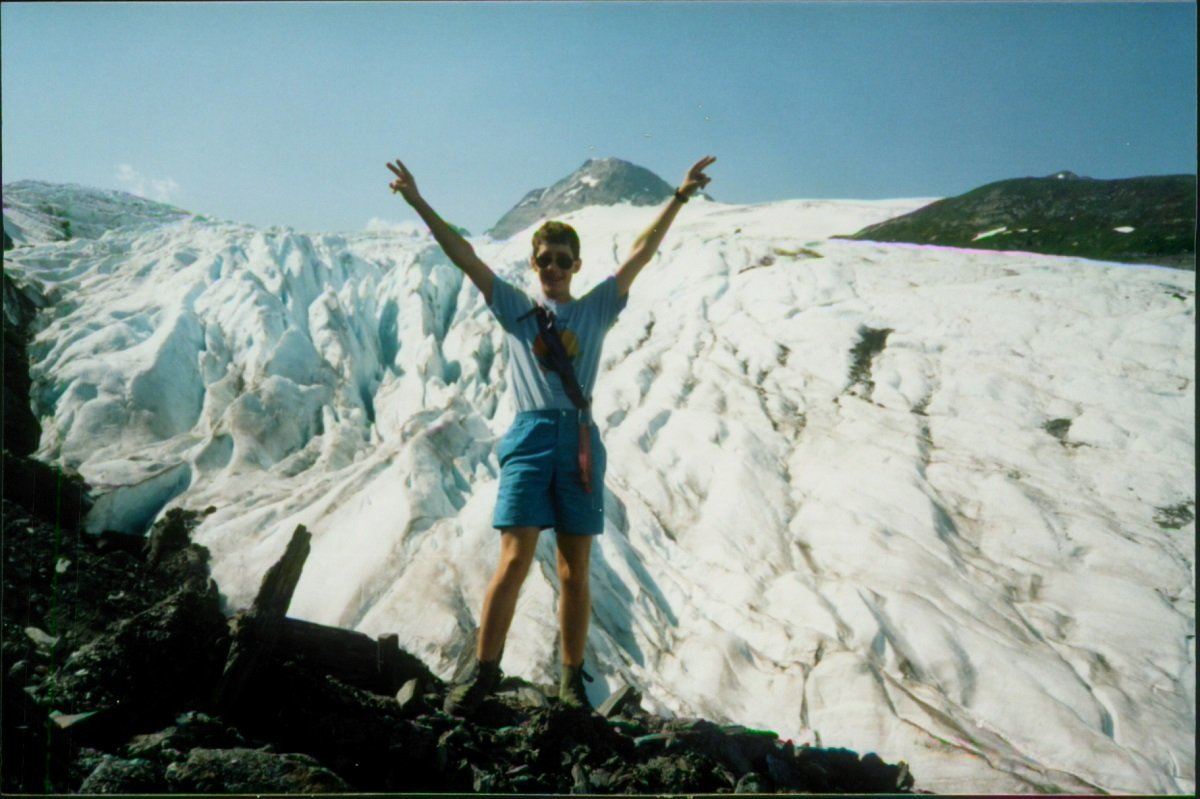 Lance rock climbing along a glacier during a family vacation