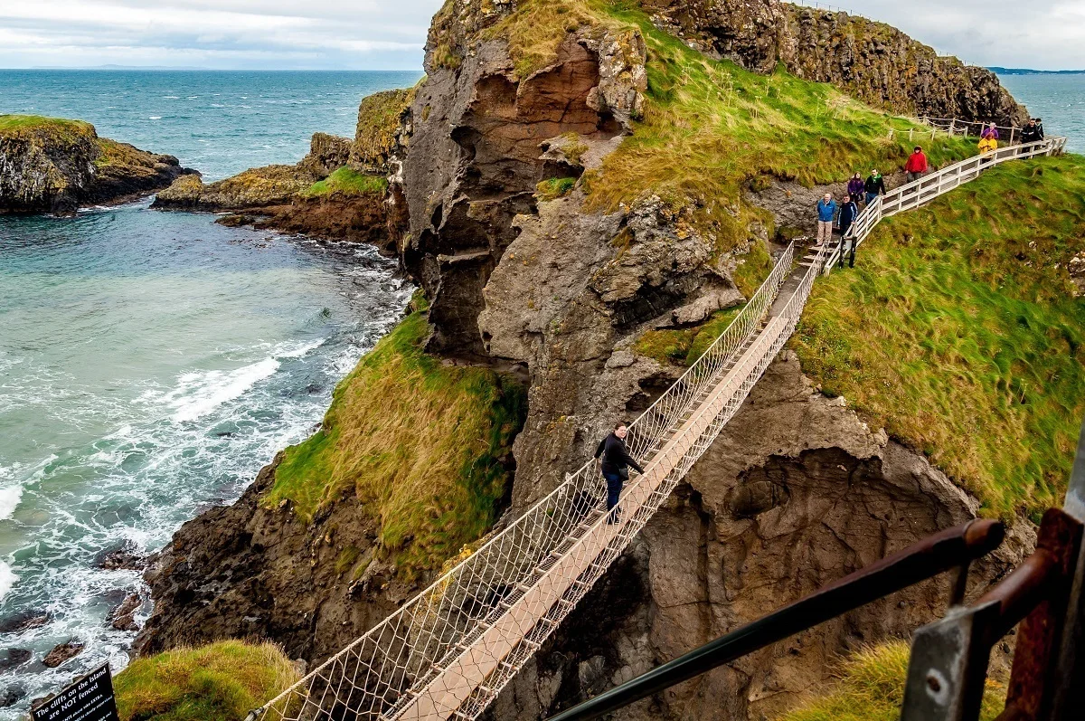Laura crossing the Carrick-a-Rede rope bridge in Northern Ireland