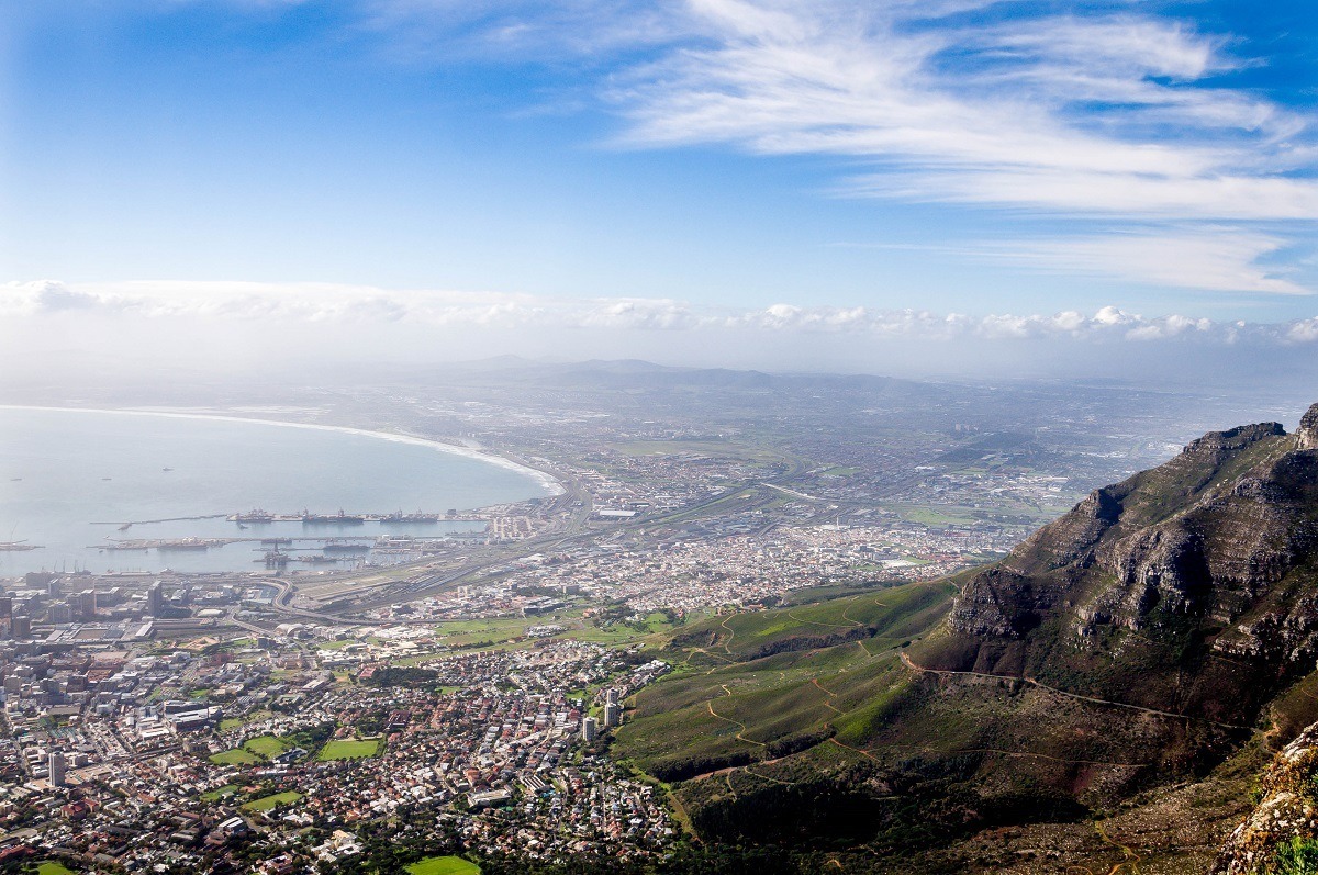 Aerial view of a bay, city, and mountainside 