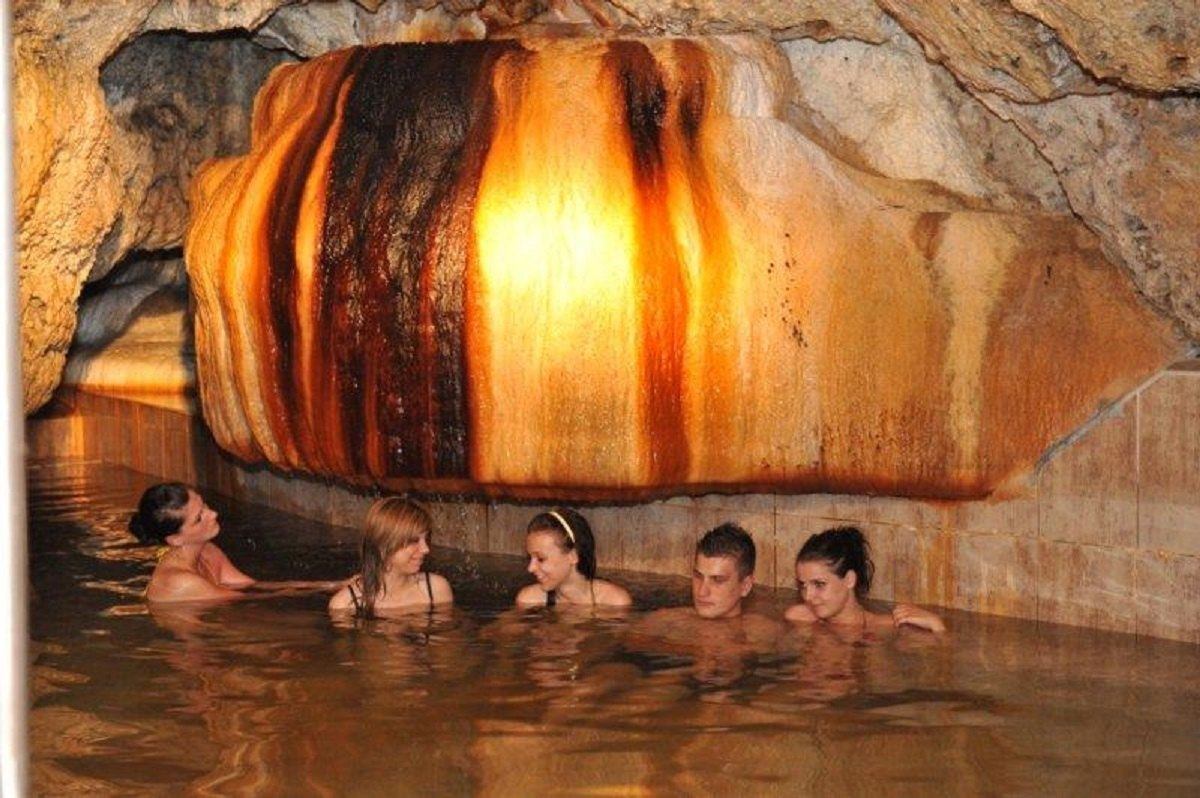 People in a cave steam bath