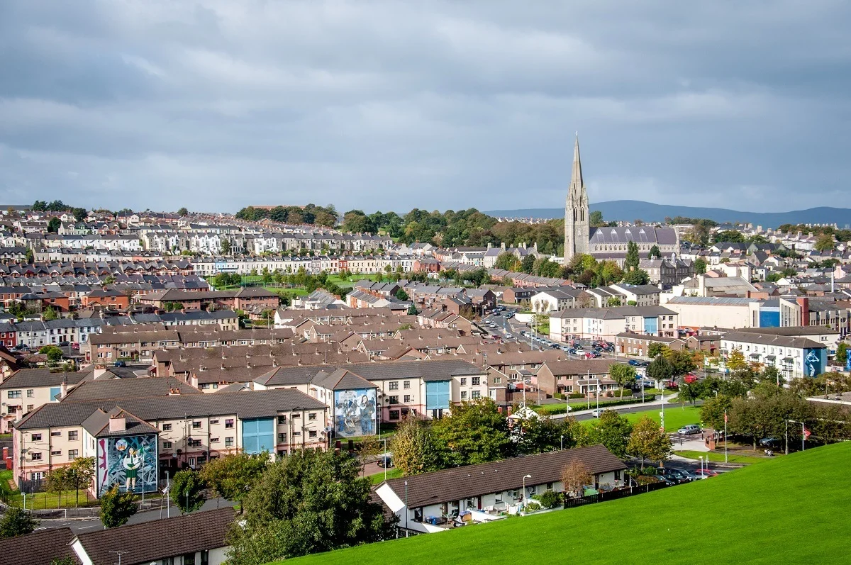 Panoramic view of buildings in a town including a large church steeple