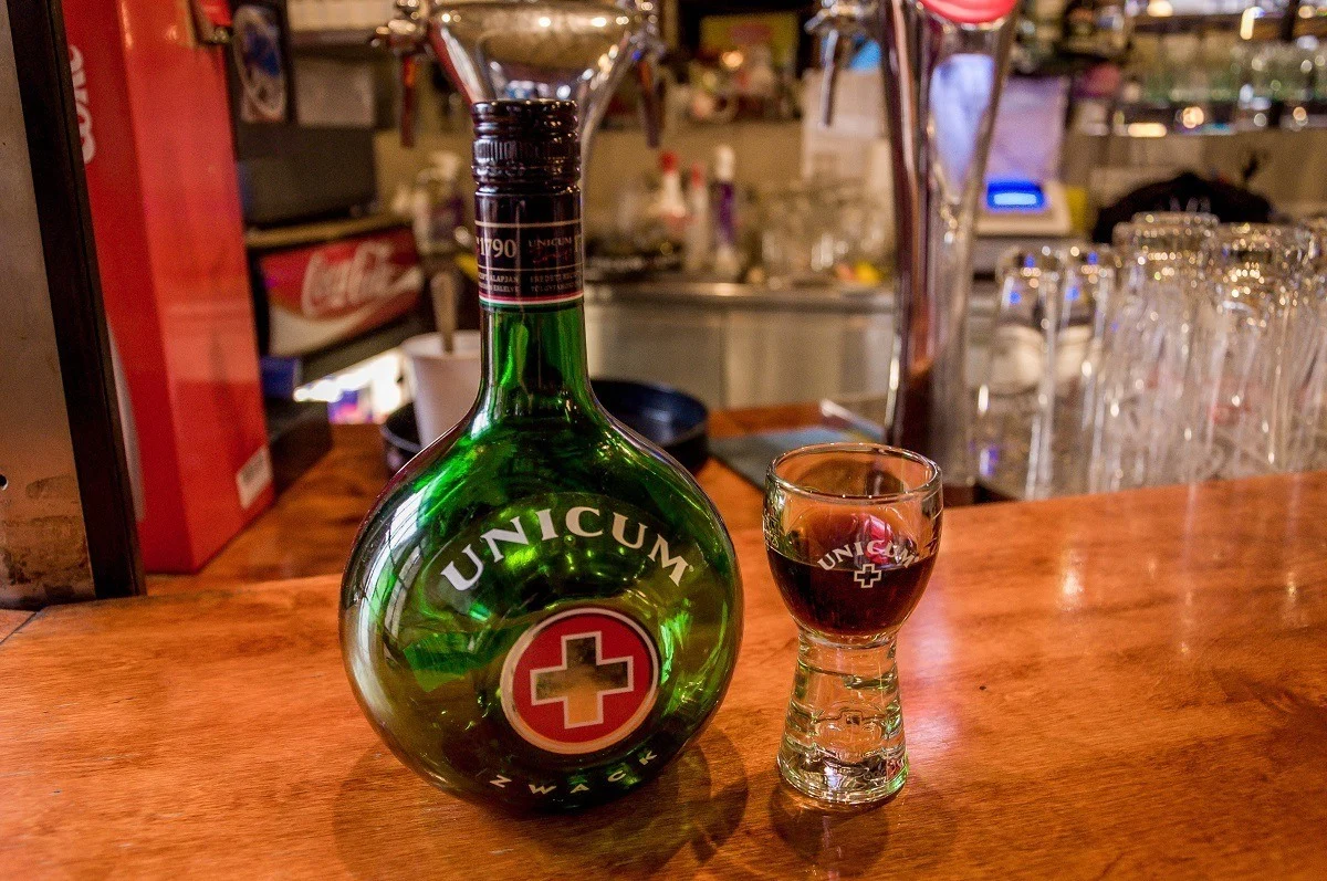 Bottle and glass of Unicum on a bar