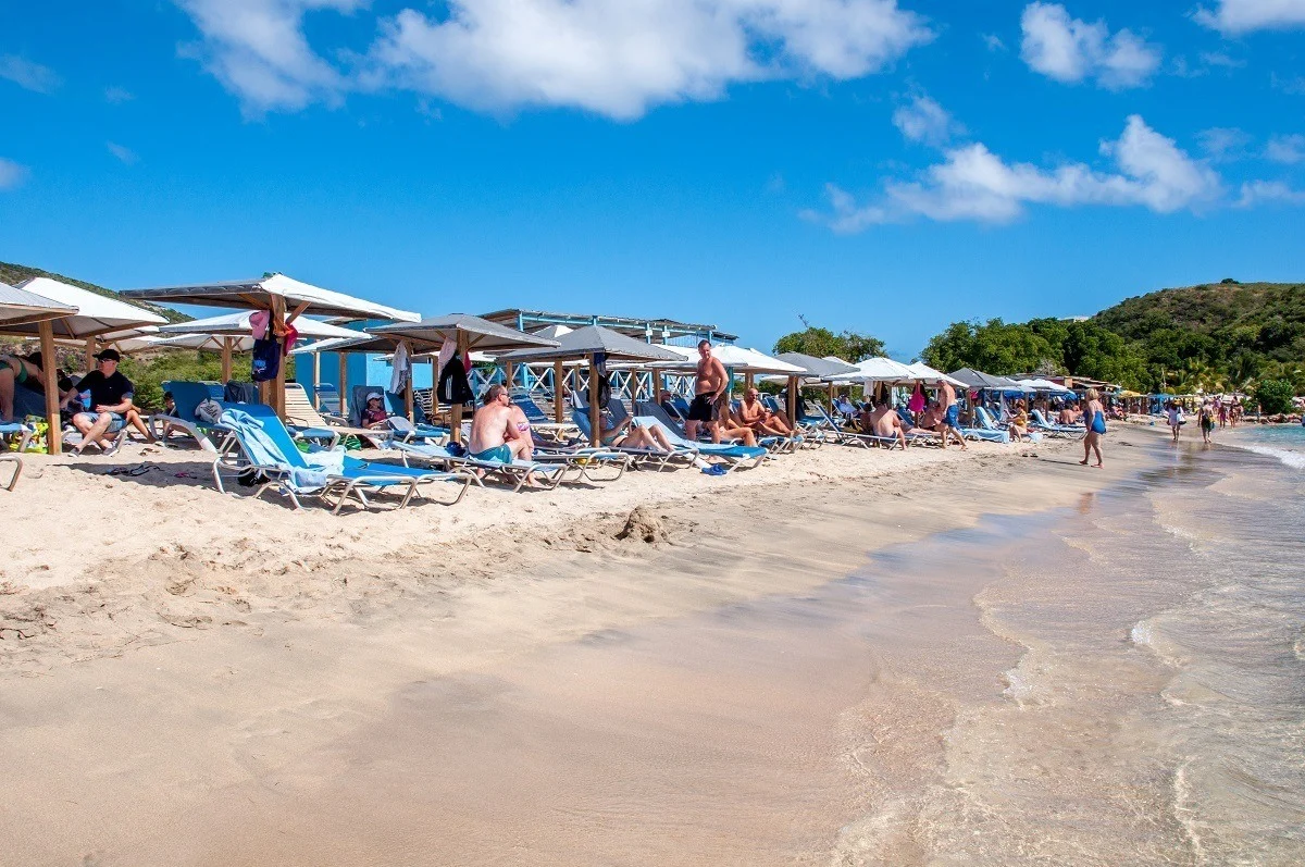 Sun loungers and umbrellas at Mundo Water Sports Bar and Grill on Cockleshell Beach