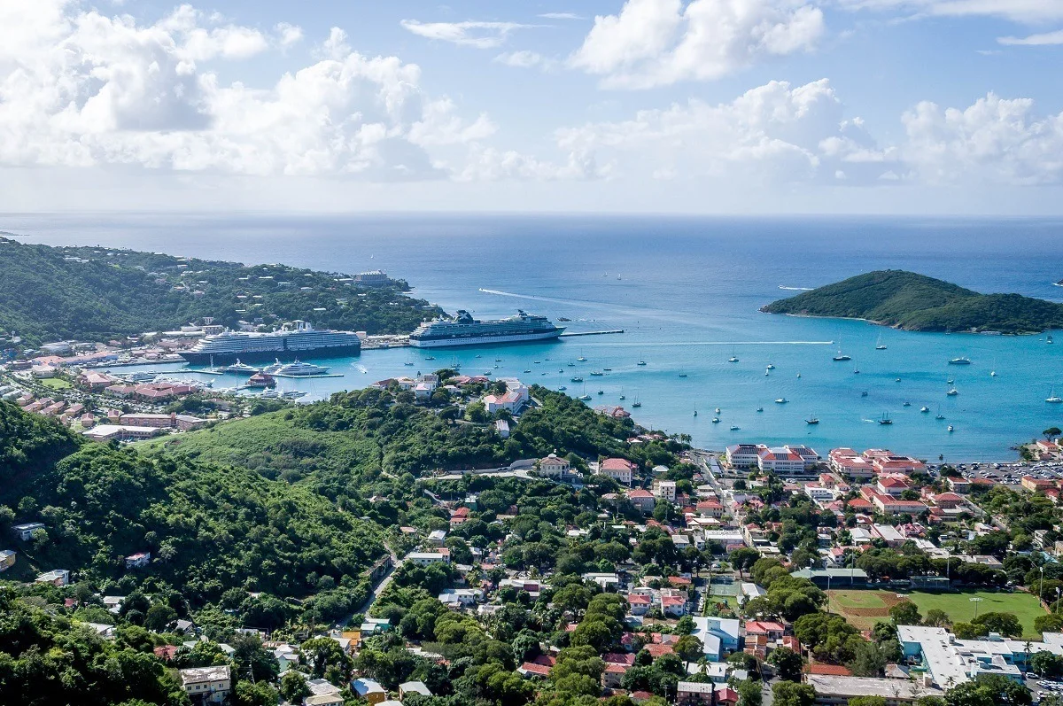 Two ships docked in a cruise port city