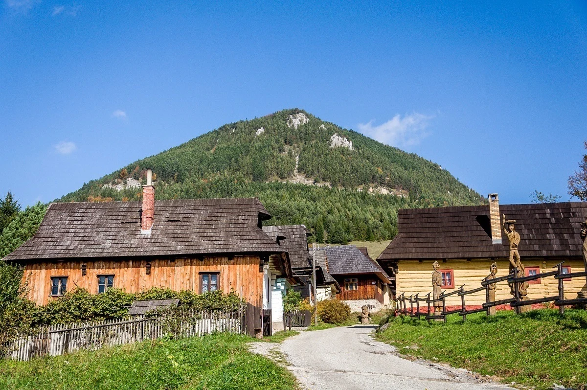 Wooden buildings at the base of a hilll