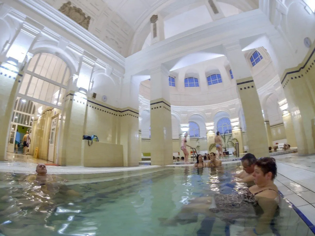 People in the indoor thermal pools at the Szechenyi Spa