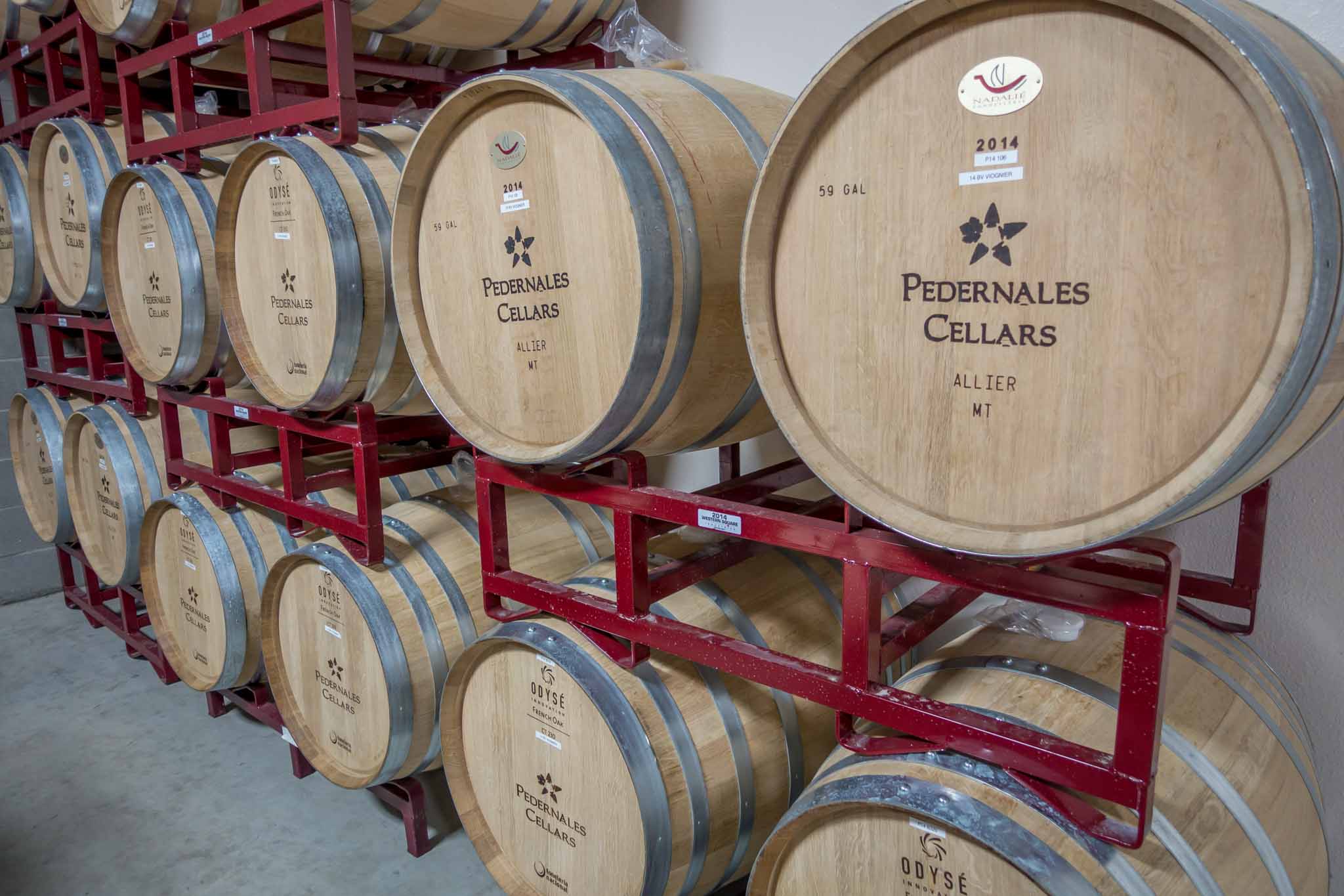 Stacked wine barrels at Pedernales Cellars.