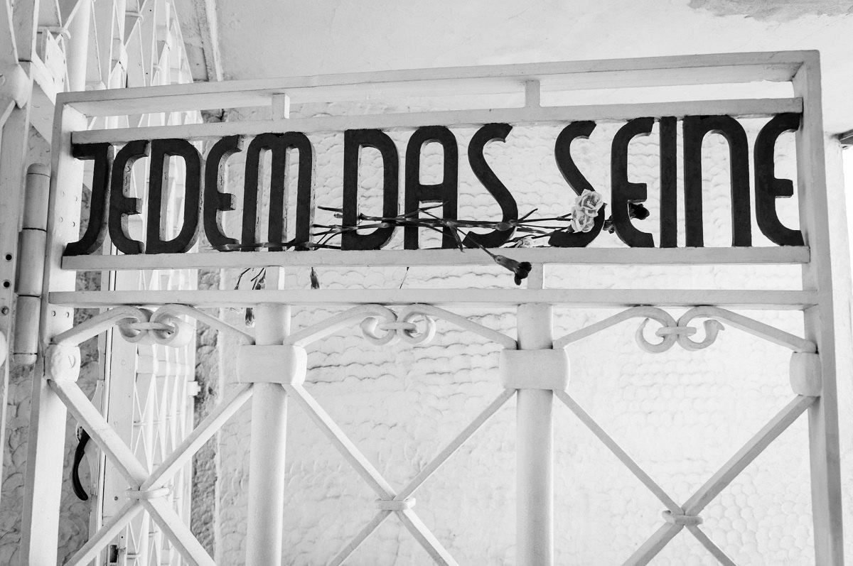 The gate Buchenwald, the Weimar Concentration Camp, reads "Jedem das Seine"