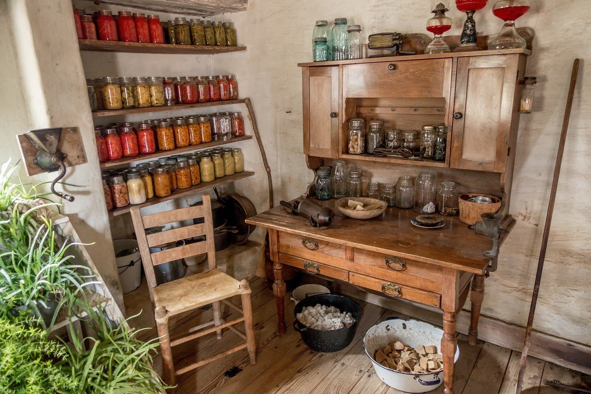 Preserved food on shelves and other kitchen items.